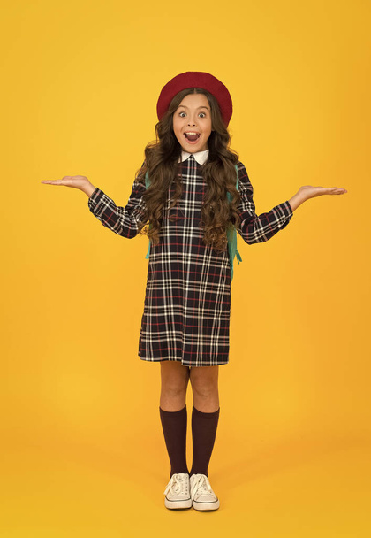 what a surprise. education. knowledge day. happy childhood. french style concept. back to school. retro girl wear uniform and parisian beret. kid school fashion. surprised child ready for schoolyear - 写真・画像