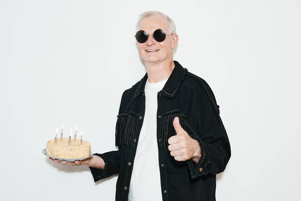Portrait of Mature Man with Birthday Cake - Foto, afbeelding