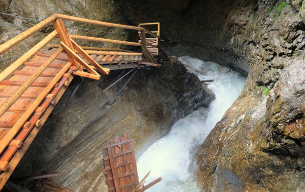 steep stairs along waterfall and rocks in austria ragaslucht - Photo, Image