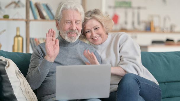 Old Couple Waving Hand for Video Chat on Laptop - Photo, Image