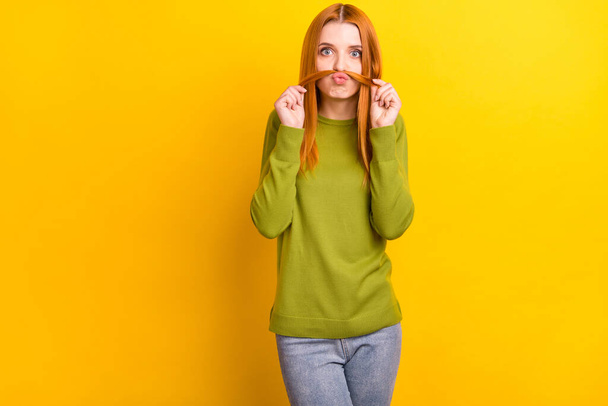 Photo portrait red haired woman playful showing fake mustache isolated vivid yellow color background - Photo, image
