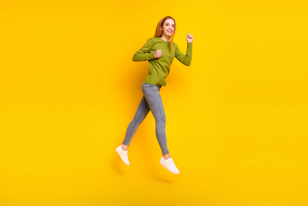 Full length body size photo jumping up gesturing like winner isolated vibrant yellow color background - Φωτογραφία, εικόνα