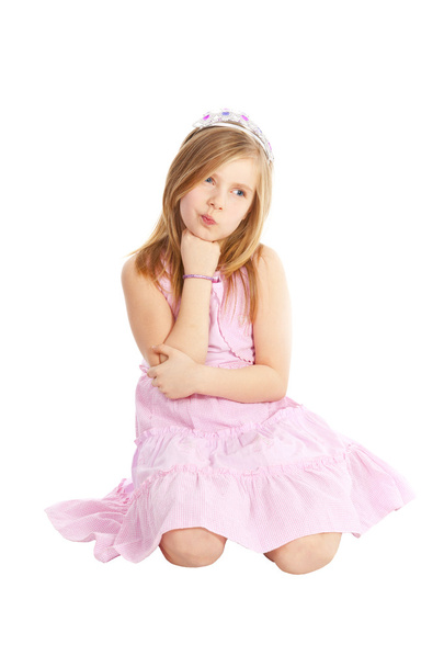 Angry little princess sitting over white - Фото, зображення