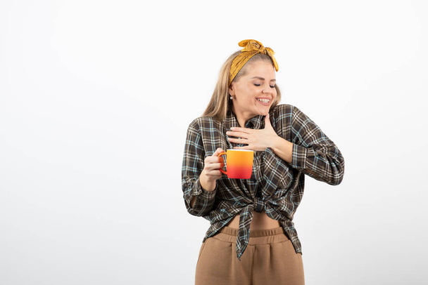 Portrait of beautiful housewife with cup of tea posing to camera. High quality photo - Photo, Image