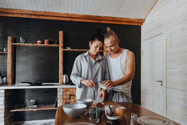 Young couple in love cook healthy food in the kitchen together.  - Foto, Imagem