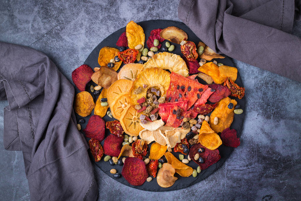 Dried fruits and vegetables, dehydrated persimmon, watermelon, pineapple, beetroot chips - Foto, Imagen