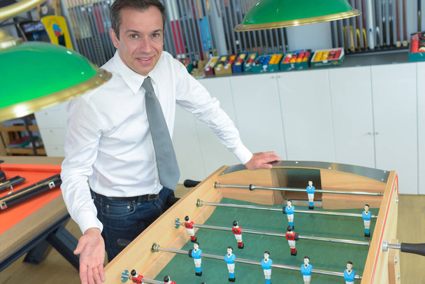 businessman playing table football - Foto, Bild