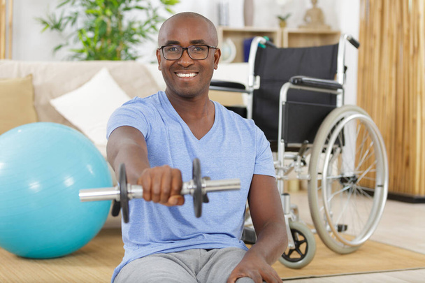disable man holding dumbbells in his hands - Photo, image