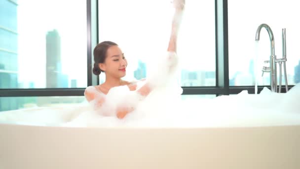 footage of beautiful Asian woman taking bath with soap bubbles - Footage, Video