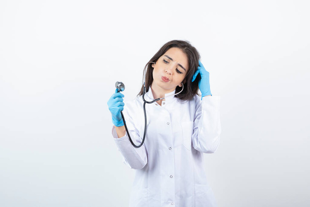 Image of female doctor using stethoscope for medical examination. High quality photo - Foto, Bild