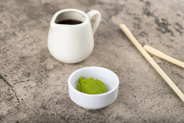 Wasabi with soy sauce placed on a stone table. High quality photo - Foto, Imagem