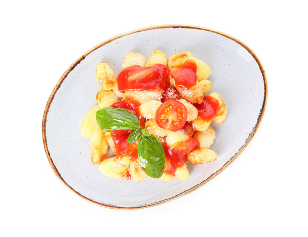Смачні ноки з томатним соусом в тарілці на білому тлі
 - Фото, зображення