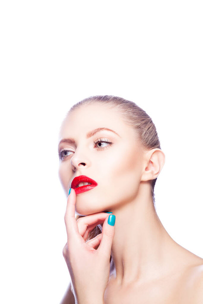 Beauty. Face of young model woman with bright make-up, perfect clean healthy skin hold hand finger near lips - Photo, Image