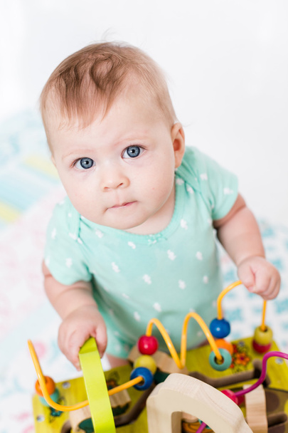 Cute baby girl with toys - Foto, Bild