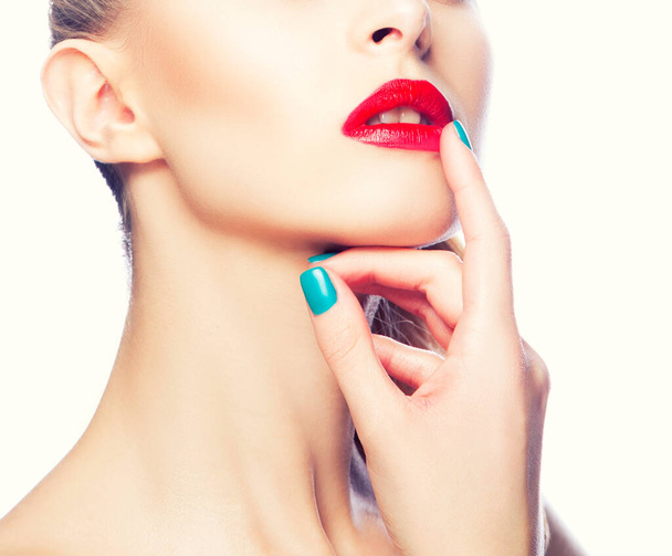 Beauty. Face of young model woman with bright make-up, perfect clean healthy skin hold hand finger near lips - Foto, Bild