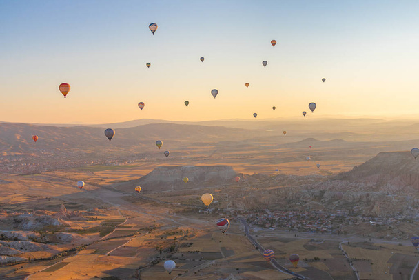 Hot air balloons in Cappadocia, Turkey. Hot air balloon flight in Goreme - Fotó, kép