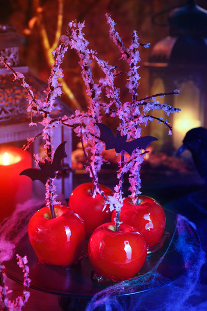 Halloween dessert. Poisoned blood caramelized glazed candy apple. Snow White Poison Lollipops.  - Photo, Image