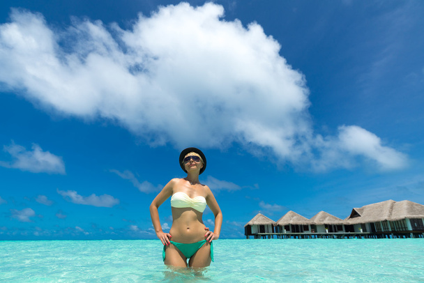Woman in bikini at tropical beach - Photo, Image