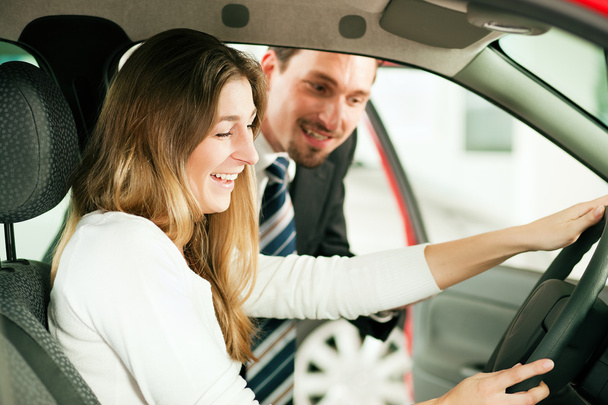 Woman buying a car in - Photo, Image