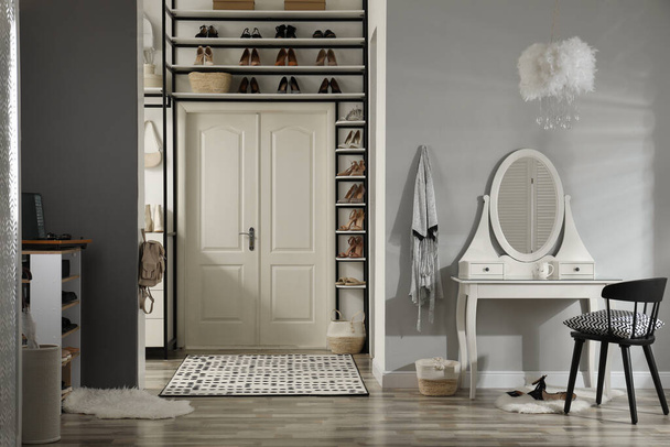 Dressing room interior with storage rack for shoes and accessories - Φωτογραφία, εικόνα