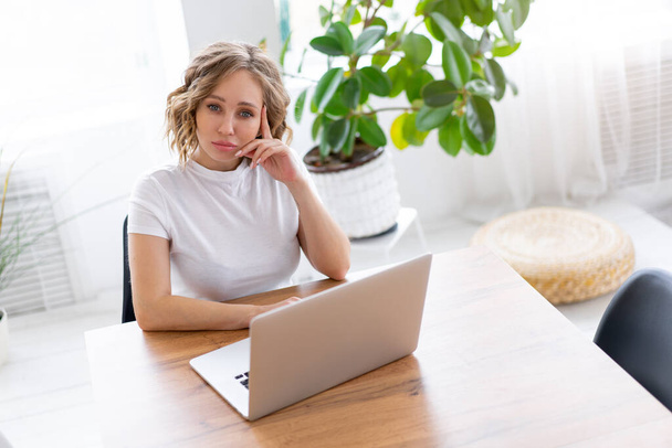 Business woman using laptop sitting near desk white office interior with houseplant looking at camera Business people Business person Online, Young and successful Dresed white shirt - Φωτογραφία, εικόνα