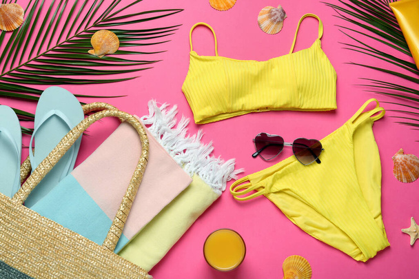 Flat lay composition with different beach objects on pink background - Valokuva, kuva