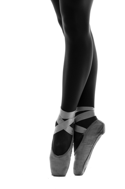 Close up of ballerinas shoes en pointe - Fotó, kép