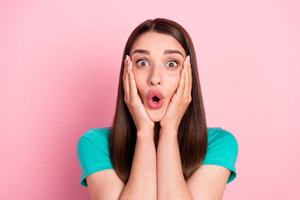 Photo of young woman amazed shocked surprised omg wow hands touch cheeks news isolated over pink color background - Foto, imagen