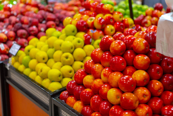 Assortment of fresh fruits on counter in supermarket - Foto, Bild