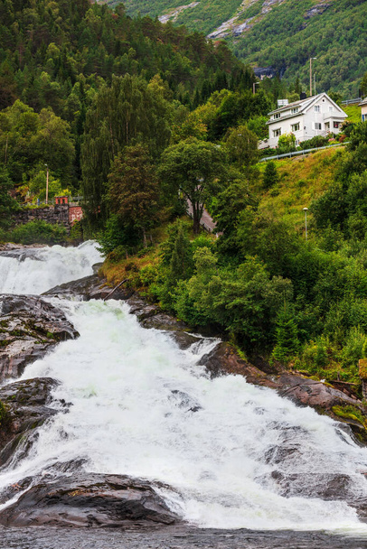 Hellesylt Fossen waterfall in the area Geirangerfjord in village Hellesylt - Φωτογραφία, εικόνα
