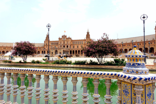 Plaza de Espana (Spain square) in Seville, Andalusia with a horse carriage                                   - Photo, Image