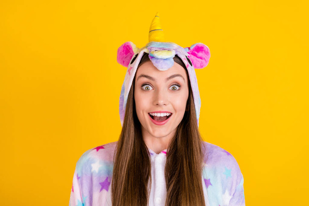 Portrait of attractive cheerful amazed girl wearing animal look good mood having fun isolated over bright yellow color background - Fotó, kép