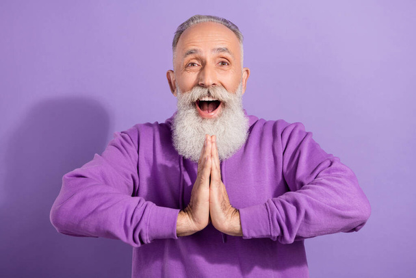 Portrait of attractive amazed cheerful grey-haired man asking favor request isolated over purple violet color background - Фото, зображення