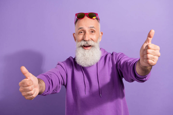 Portrait of attractive elderly cheerful grey-haired man showing double thumbup solution isolated over purple violet color background - Photo, image