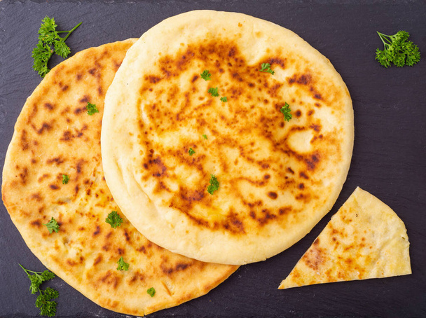 Traditional caucasian food . Homemade khachapuri bread with cheese - Foto, imagen