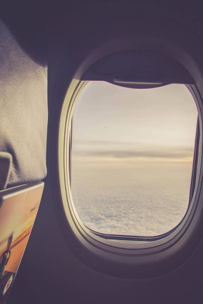airplane window opening in warm filter - Фото, изображение
