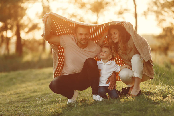 Cute family playing in a summer field - Photo, Image