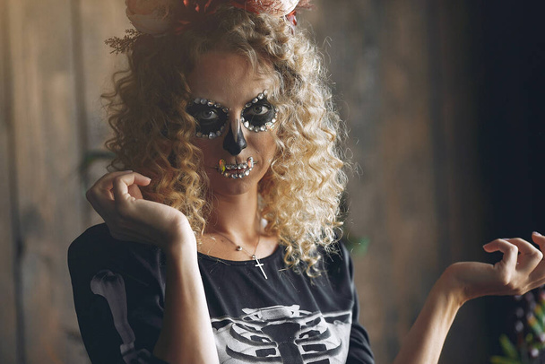 Portrait of smiling woman with Halloween skull make up - Zdjęcie, obraz
