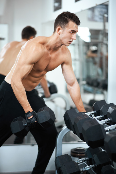 man doing exercises dumbbell bicep muscles - Photo, Image