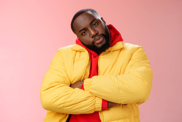 Show me whatcha got. Portrait cool stylish serious-looking urban black bearded guy in trendy yellow hoodie cross arms over chest tilting head wanna see what prepared rival standing confident - Photo, Image