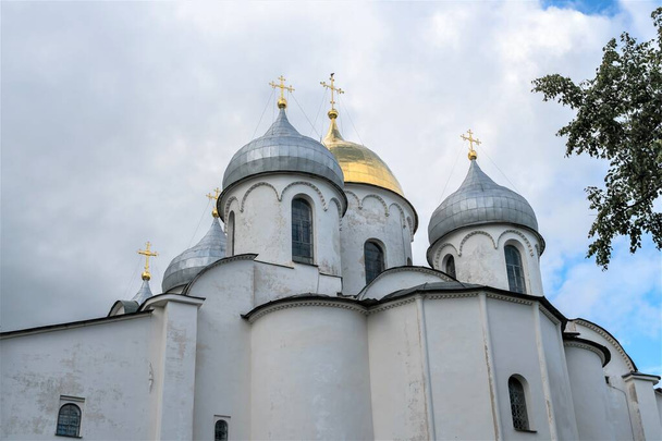 Russia, Veliky Novgorod, August 2021. View of the walls, domes and crosses of St. Sophia Cathedral. - Fotó, kép