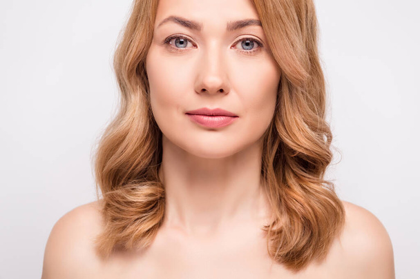 Photo portrait woman serious face nude shoulders blonde hair isolated white color background - Fotó, kép