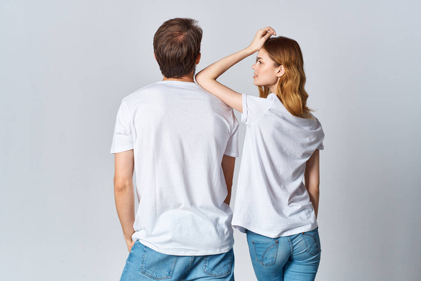 man and woman in white t-shirts design studio back view mocap - 写真・画像