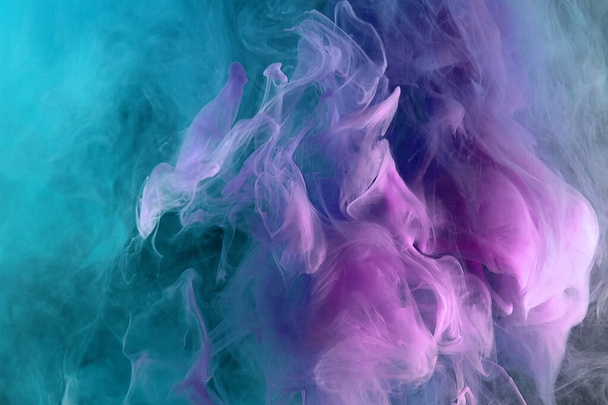 Abstract pink and blue and green color background. Swirling vibrant hookah smoke, dynamic paint in water. Textured background indoors natural ligt front view. - Fotoğraf, Görsel