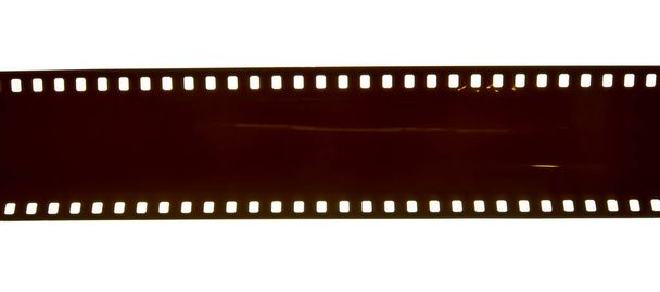 白色を背景にした35mmネガフィルム - 写真・画像