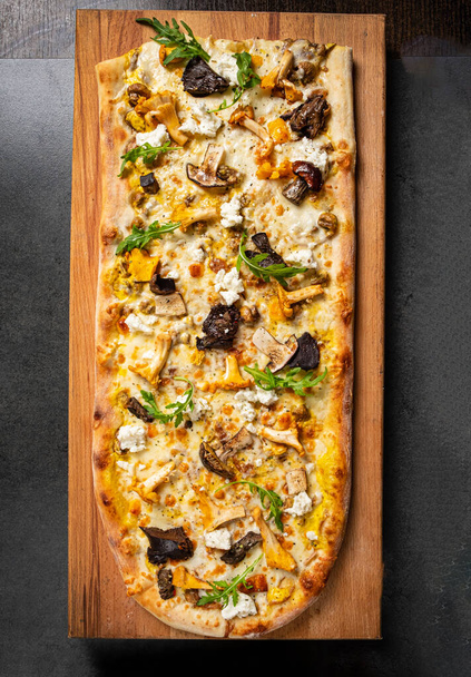 pizza with mushrooms on the wooden background - Photo, Image