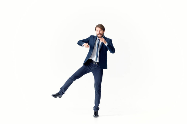 a man in a jacket and tie movement Jump office Studio - Zdjęcie, obraz