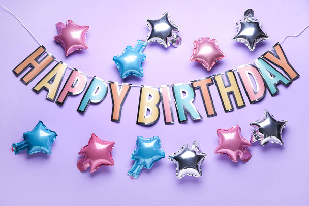 Різні кульки і текст HAPPY BIRTHDAY на кольоровому фоні
 - Фото, зображення