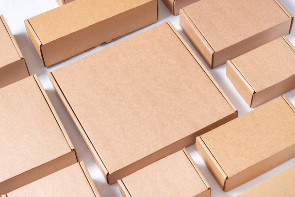 Lot of flat brown cardboard boxes - Фото, зображення