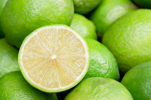Lime slice citrus fruits background. Fresh juicy limes. Healthy foo - Fotografie, Obrázek